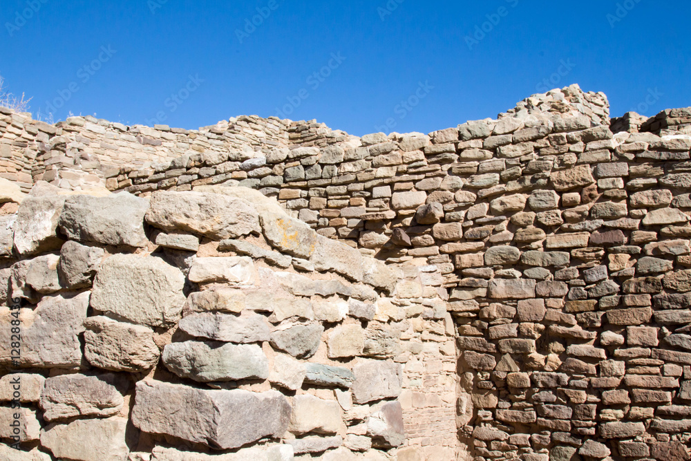 Sandstone walls and blue sky at an abandoned Pueblo site in Aztec, NM Sandstone walls and blue sky at an abandoned Pueblo site in Aztec, NM