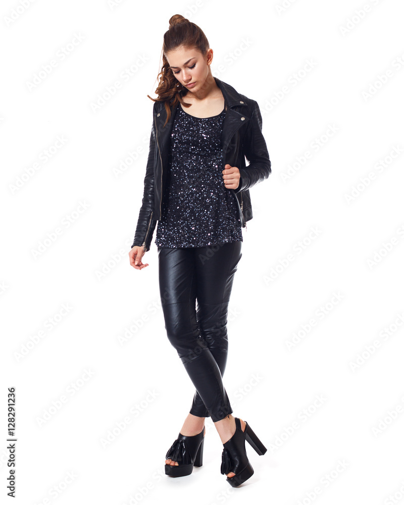 Sexy young brunette in black clothes. Isolated Sexy young brunette in black clothes. Isolated