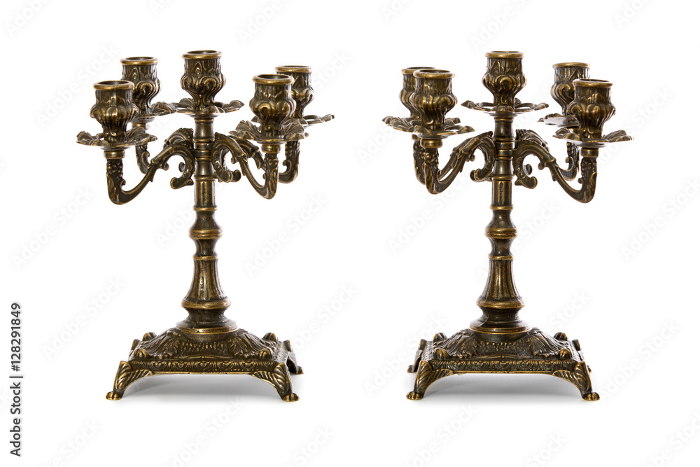 Two vintage bronze candle holder on a white background