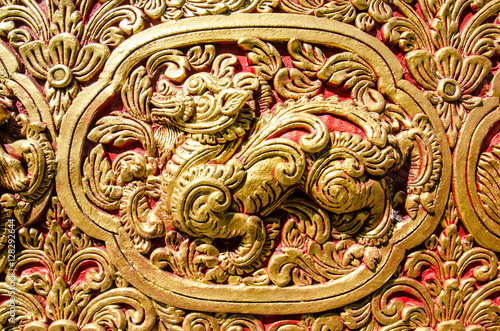 Close Up Beautiful StuccoThai Traditional Art Fantastic Beast or Animal(Lai Thai) Handmade Background Wallpaper Texture