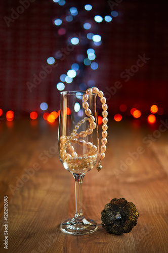 Glass of champagne and beads