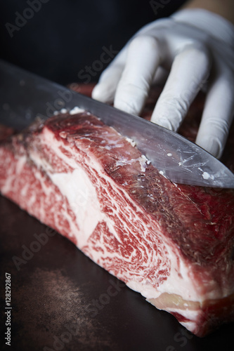 Slicing aged beef