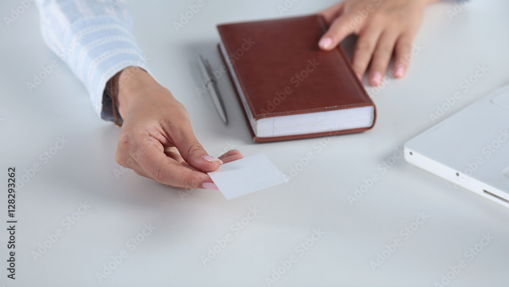 Woman Hand showing a blank business card Woman Hand showing a blank business card