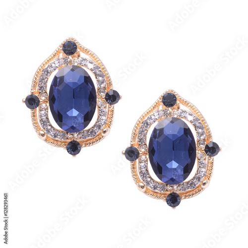 gold earrings with blue stones isolated on white