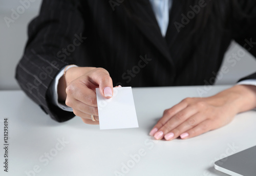 Woman Hand showing a blank business card