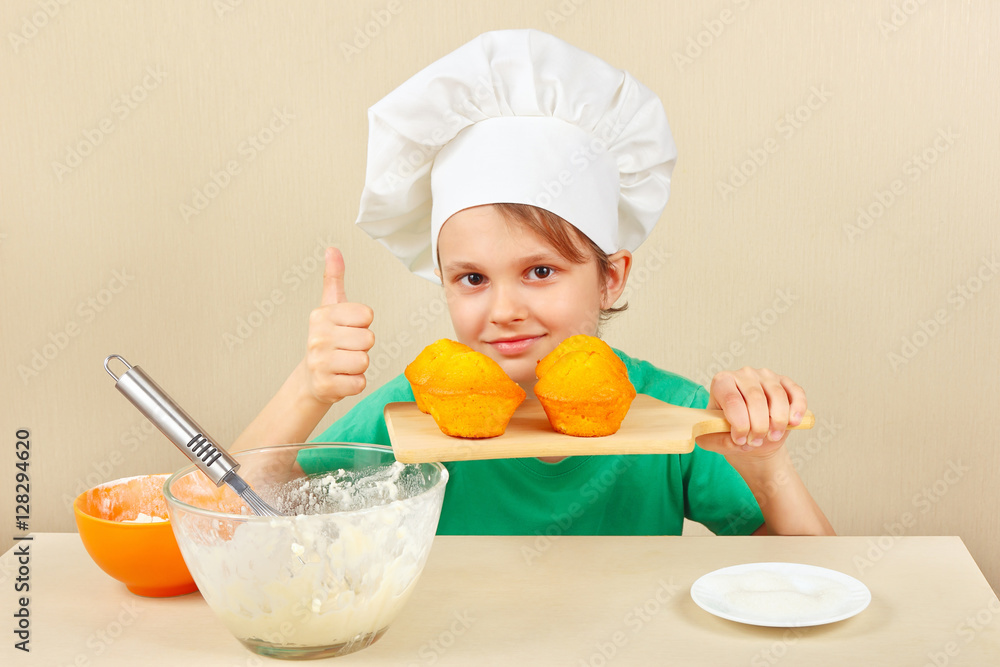 Little funny chef with a cooked the appetizing cake Little funny chef with a cooked the appetizing cake