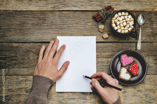 male hands writing a letter
