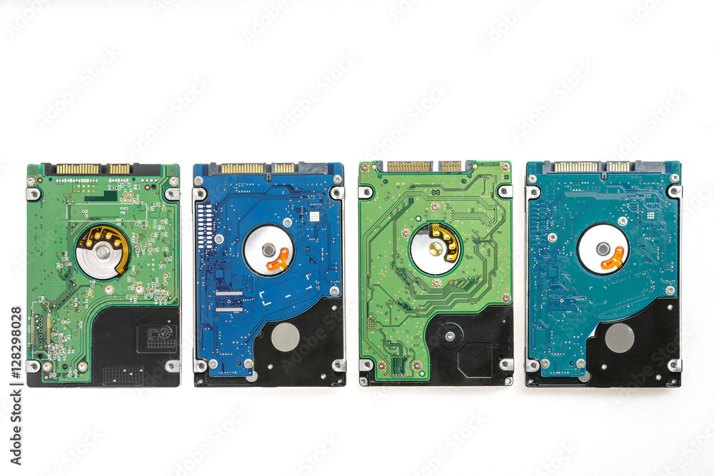 Four different 2.5 inch laptop HDD's. View of the back side, from the PCB. Isolated on white background. Four different 2.5 inch laptop HDD's. View of the back side, from the PCB. Isolated on white background.