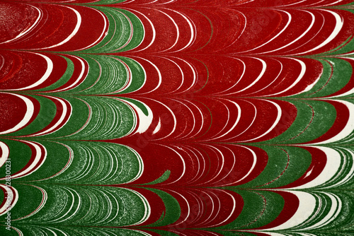 Ebru art. Traditional Turkish Ebru technique. Painting on water, followed by paper prints. Color paint ebru with waves and tile pattern.