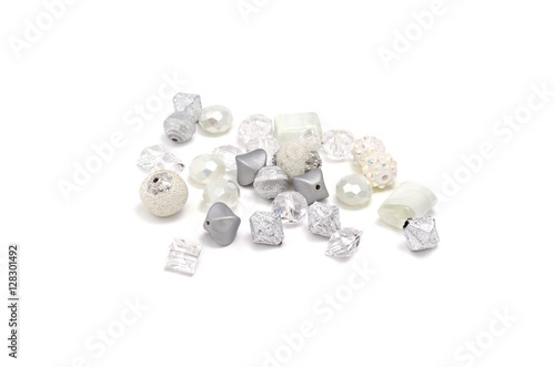 Fototapeta Naklejka Na Ścianę i Meble -  Decorative colorful beads scattered on white background - accessories for handmade and hobby