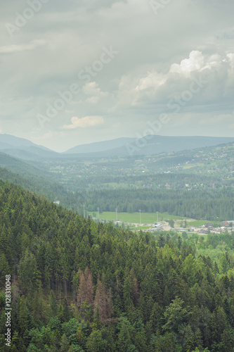 mountains under mist in the morning and city in the valley
