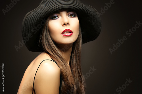 Portrait of beautiful young woman model with bright makeup on dark background