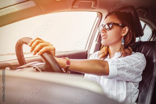 Asian woman driving a car