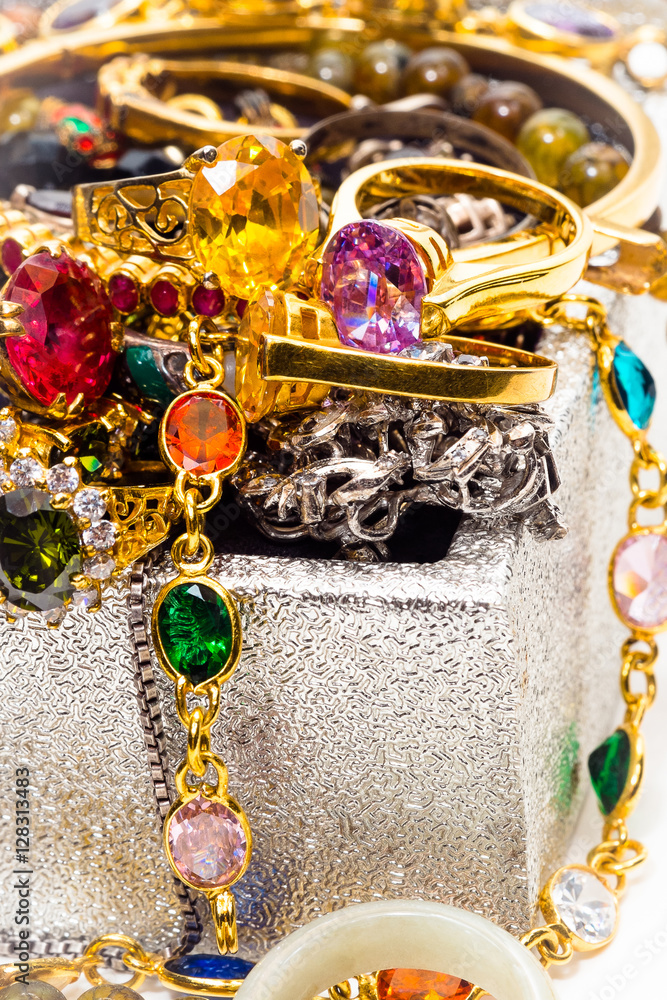 Treasure chest filled with many gold, jewels and precious gem stones