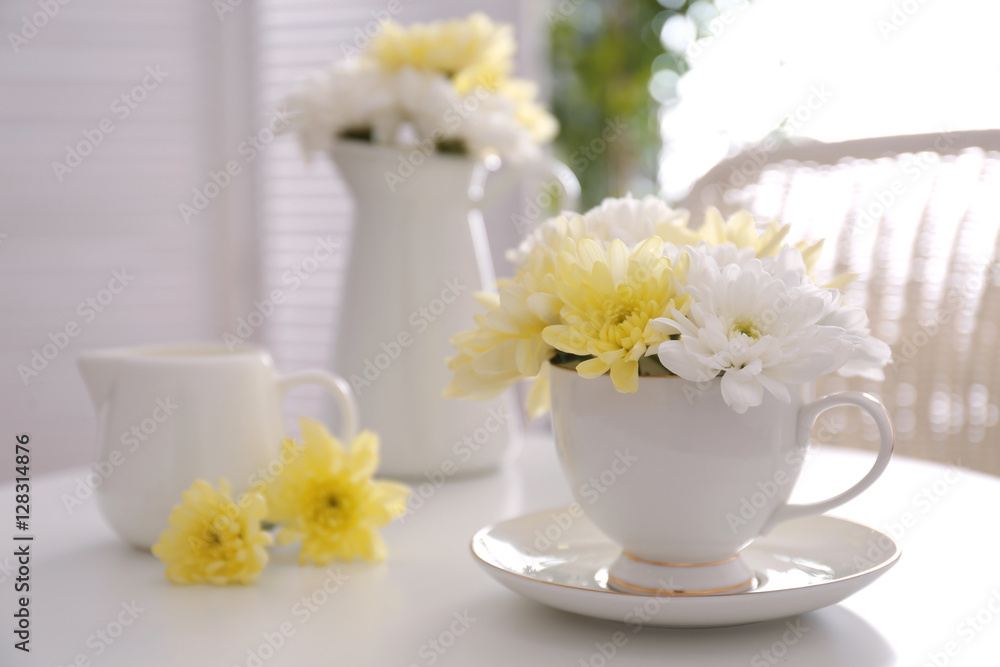 Flower bouquet of chrysanthemum in cup on table