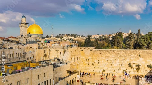 View to Western Wall known at the Wailing Wall or Kotel in Jerusalem is a major Jewish sacred place, Old city and the Temple Mount, Dome of the Rock and Al Aqsa Mosque - Time Lapse, Pan Right