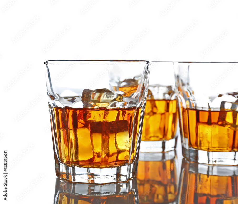 Glasses of whisky with ice isolated on white Glasses of whisky with ice isolated on white
