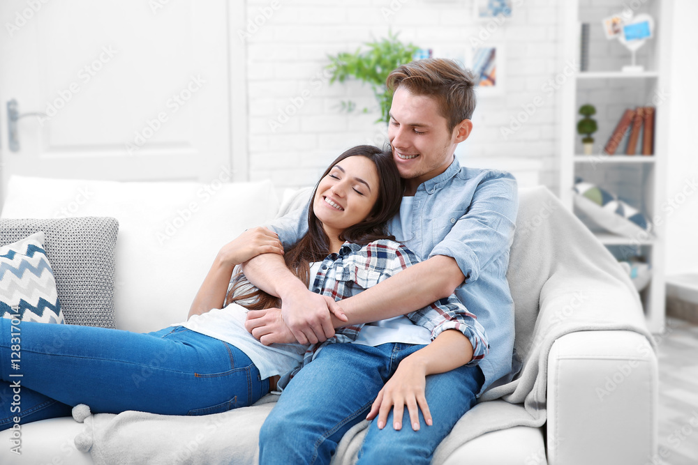 Lovely couple relaxing on couch Lovely couple relaxing on couch
