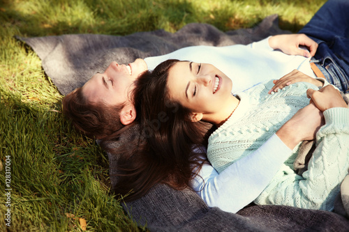 Lovely couple relaxing in park