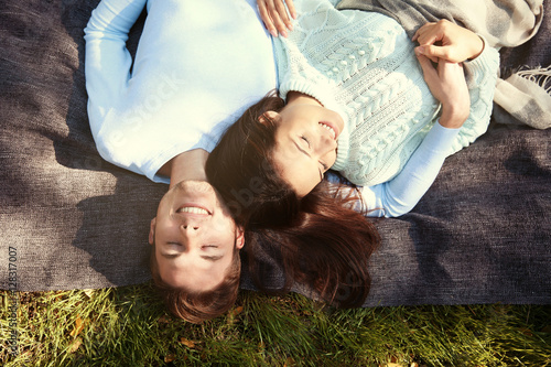 Lovely couple relaxing in park