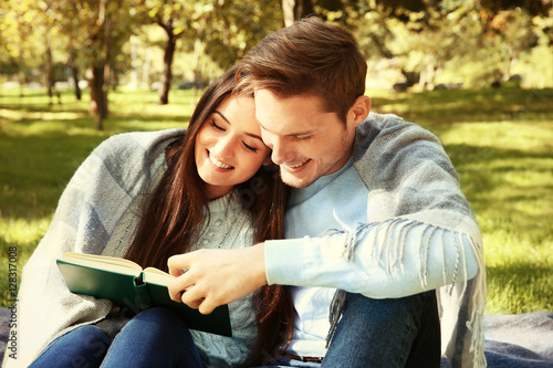 Lovely couple relaxing in park