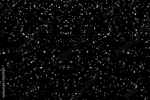 snow flying over the black background, use as texture, pattern o