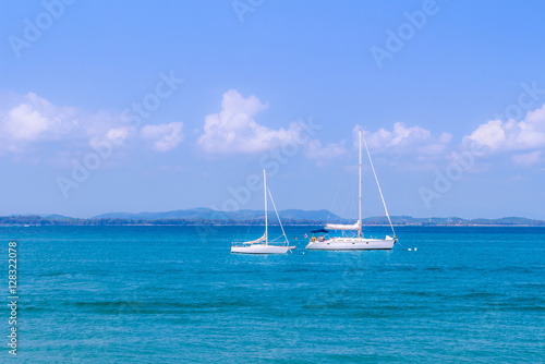 Sea with sailboat for background.
