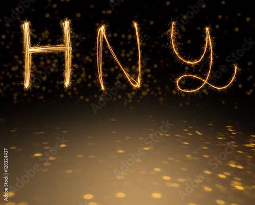 happy new years  fireworks Sparkle alphabet on gold bokeh background. HAPPY NEW YEAR concept..