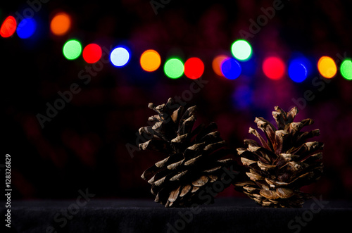 new year two pine cone on a christmas garland background