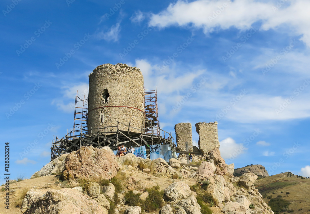 ruins of ancient tower on top of a mountain