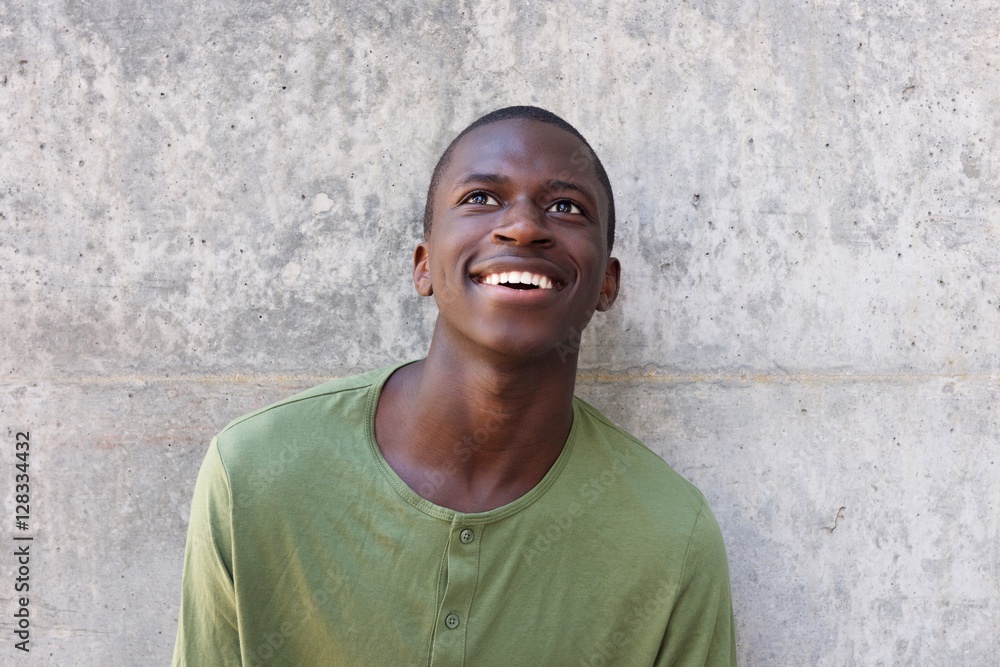 Happy african man looking up Happy african man looking up