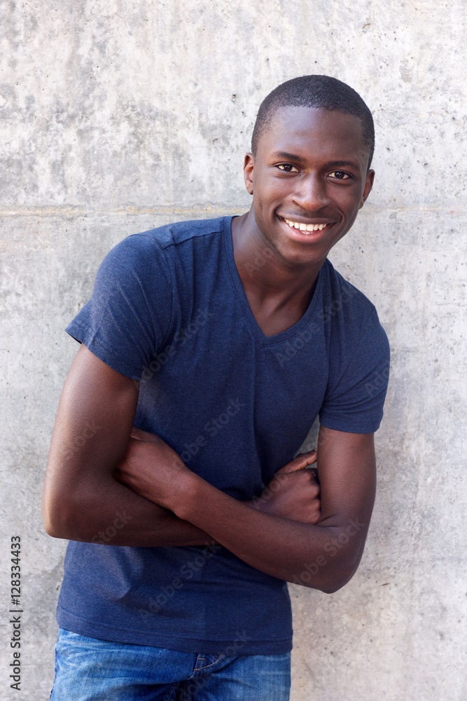 African american guy smiling with arms crossed African american guy smiling with arms crossed