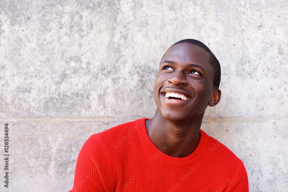 Young african man looking away and smiling Young african man looking away and smiling