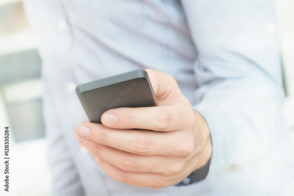 Urban guy / businessman with a cellphone. Shallow depth of field. Urban guy / businessman with a cellphone. Shallow depth of field.