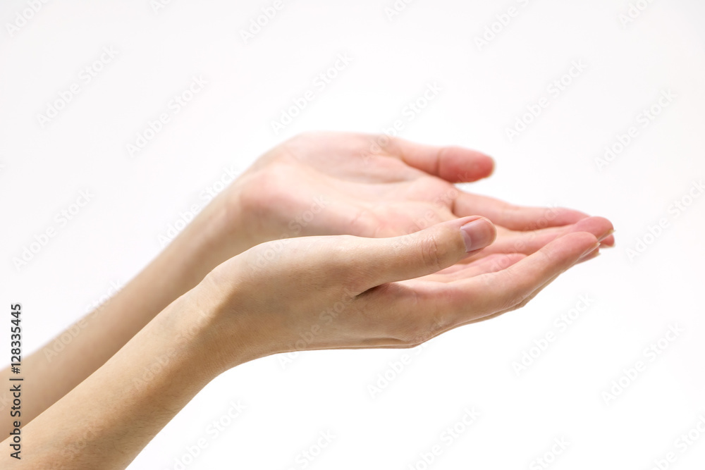 isolated woman's hand in front of white wall

