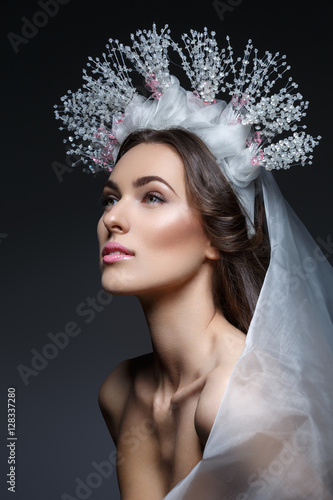 Beautiful girl in crystal crown and veil