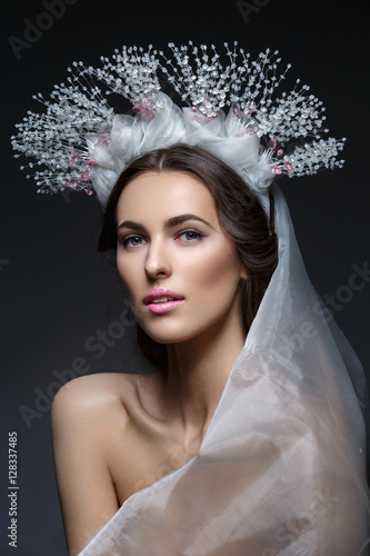 Beautiful girl in crystal crown and veil