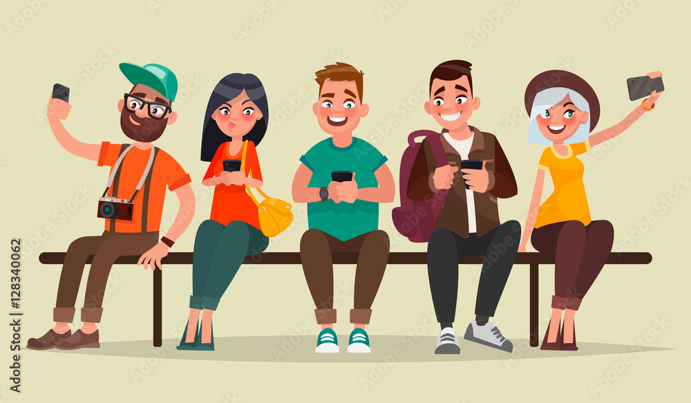 People and gadgets. Group of students sitting on a bench enjoyin People and gadgets. Group of students sitting on a bench enjoyin