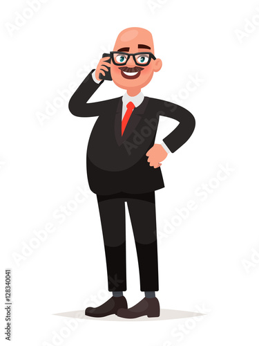 Adult man with glasses and dressed in a business suit talking on