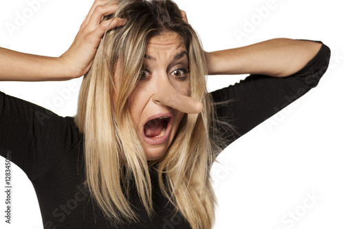 shocked young woman looking...