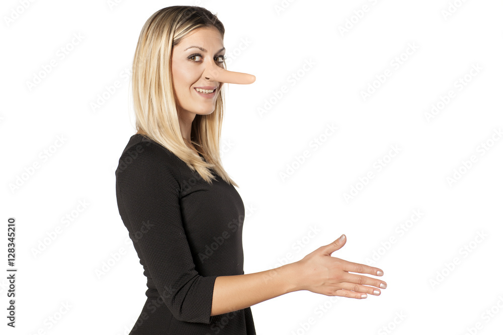 smiling young woman with an elongated nose shaking hand. concept of lying smiling young woman with an elongated nose shaking hand. concept of lying