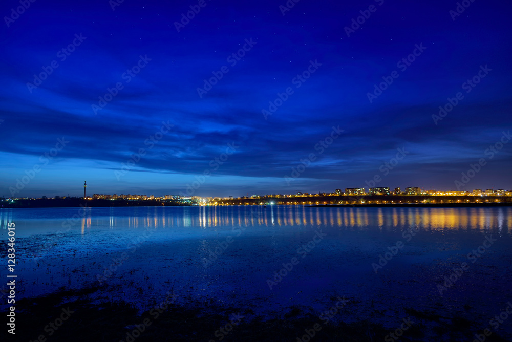 Night view at blue hour of Galati City, Romania with reflections