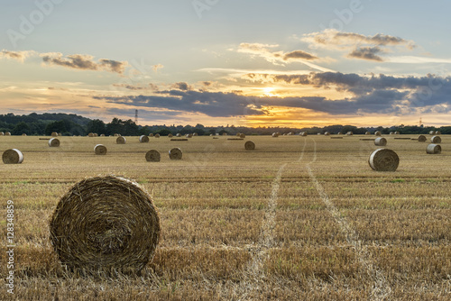 Beautiful countryside landscape image of hay bales in Summer fie