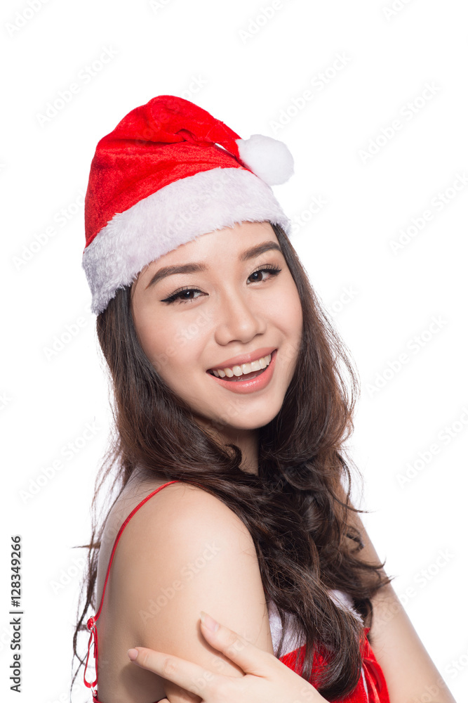 Christmas Woman. Beauty Asian Model Girl in Santa Hat isolated o Christmas Woman. Beauty Asian Model Girl in Santa Hat isolated o