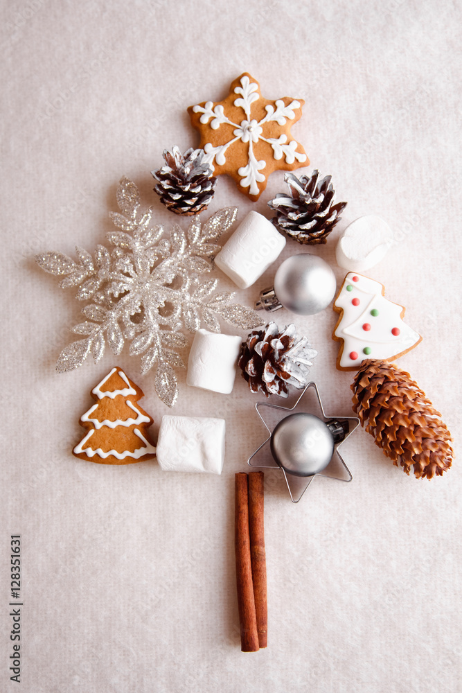 Beautiful Christmas tree made of gingerbread, marshmallows and Christmas decoration on light background Beautiful Christmas tree made of gingerbread, marshmallows and Christmas decoration on light background