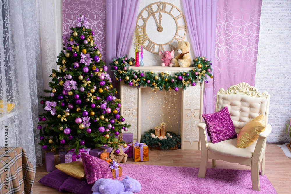 Fototapeta premium Christmas tree decorated in purple toy. background with gifts