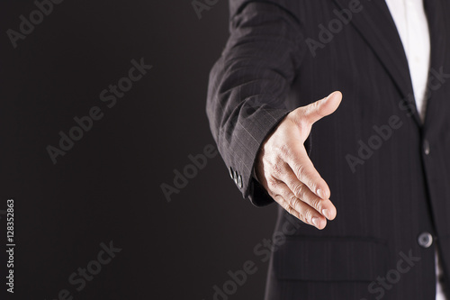 Businessman performing a hand gesture. photo