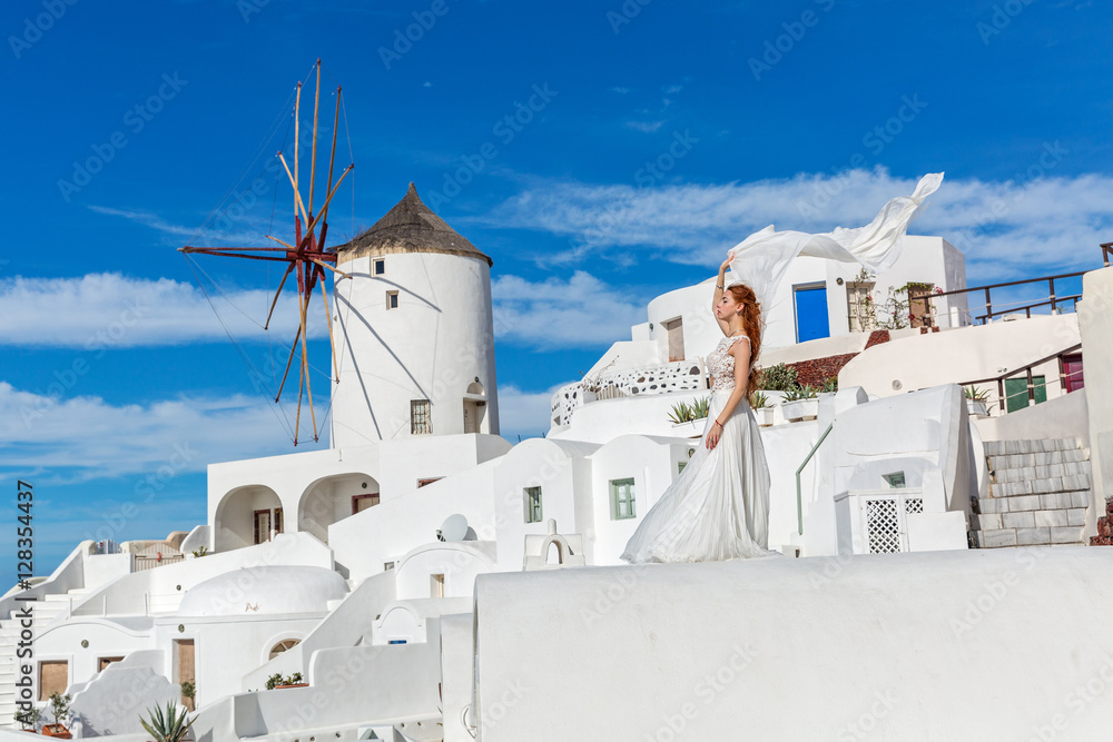 Fototapeta premium Beautiful woman in white dress