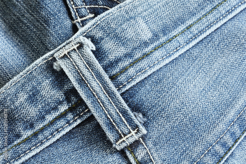 Close up detail of belt loops on denim jeans texture photo