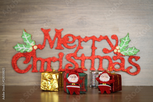 Merry Christmas message on wooden background